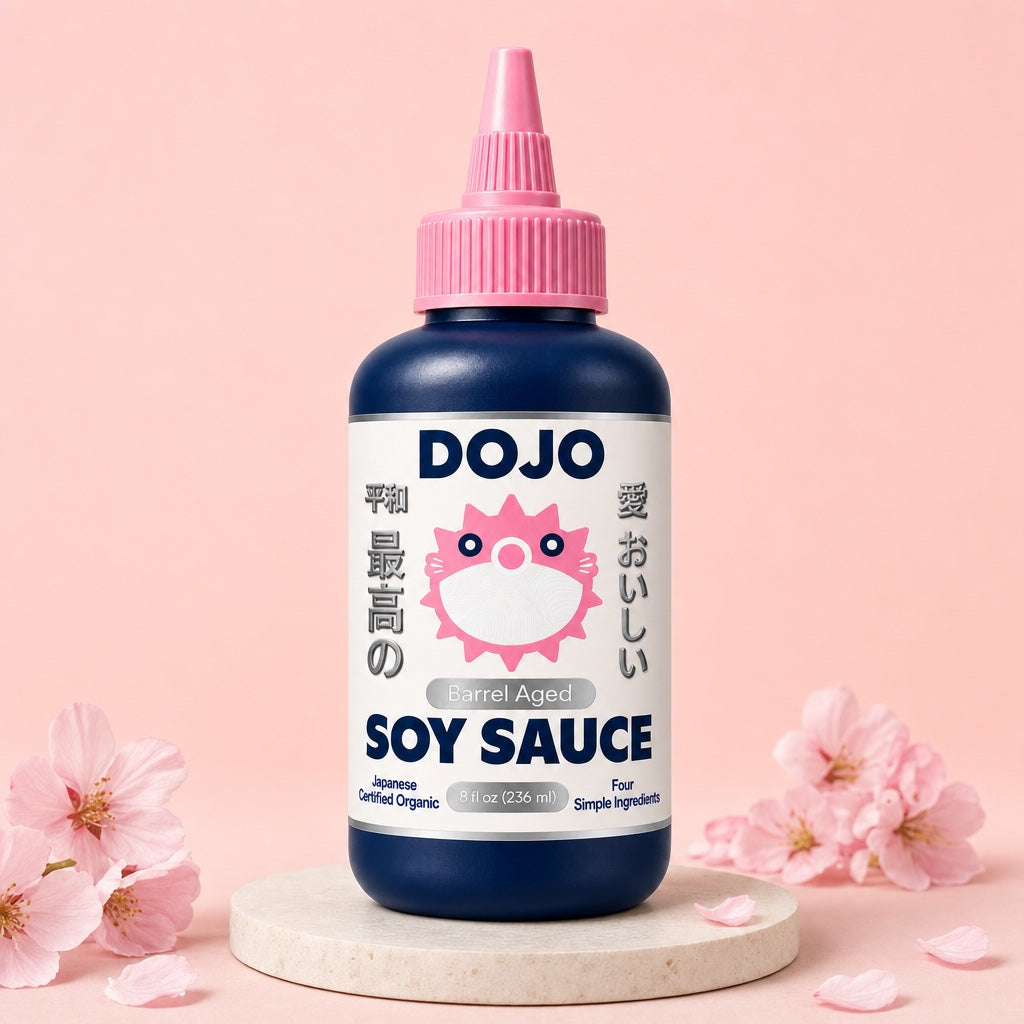 DOJO barrel aged soy sauce bottle on a stone plinth: two winters in cedar, barrel aged 24 months, four ingredients, brewed in Japan