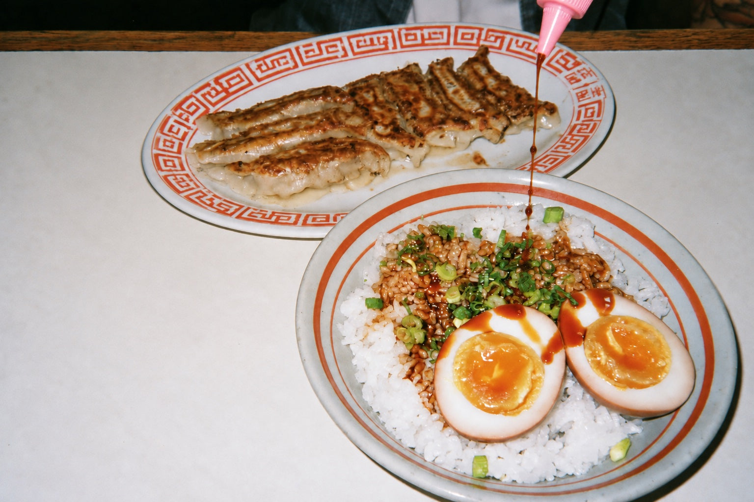 A fine drizzle of DOJO soy sauce over an everyday meal
